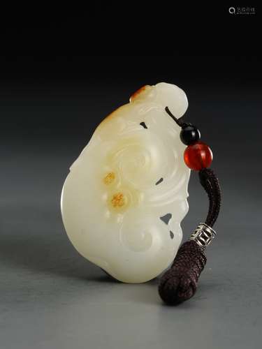 A  WHITE AND RUSSET  WHITE JADE ORNAMENT