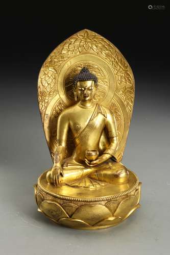 A BRONZE SEATED FIGURE OF SHAKYAMUNI