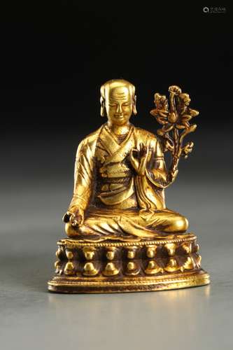 A GILT BRONZE MASTER STATUE