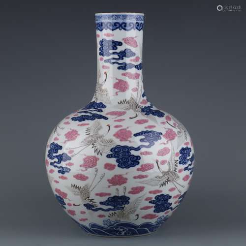 A  QIANLONG BLUE AND WHITE FAMILLE ROSE  CLOUD VASE