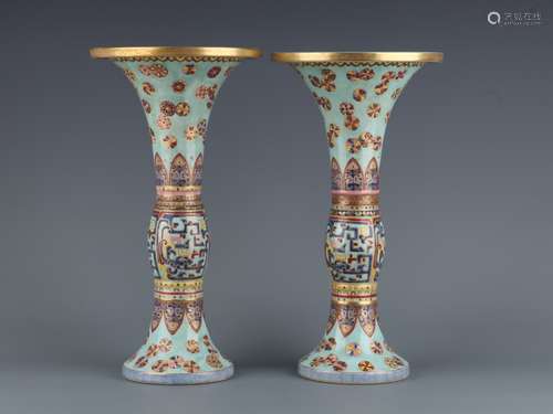 A PAIR OF QIANLONG GREEN GROUND GILT DECORATED DRAGON BEAKER...