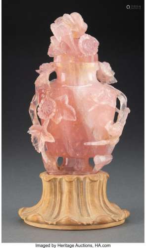 A Chinese Carved Rose Quartz Covered Vase on a Carved Wood B...