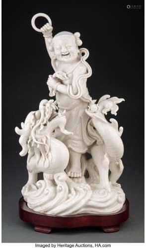 A Chinese Blanc-de-Chine Figure of Nezha and Dragon on a Car...