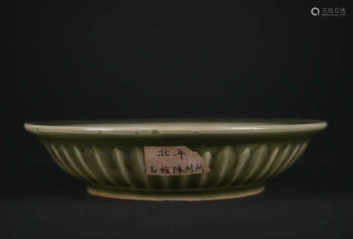 A celadon-glazed dish