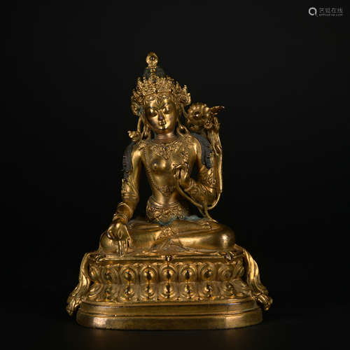 A gilt-bronze statue of Tara