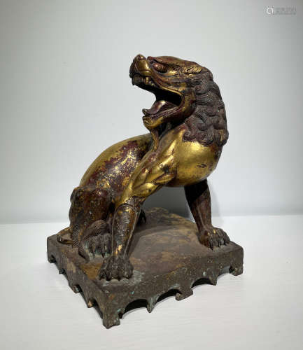 A gilt-bronze lion