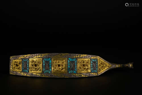 A bronze buckle ware with gold and silver