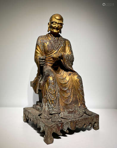 A gilt-bronze statue of Guru