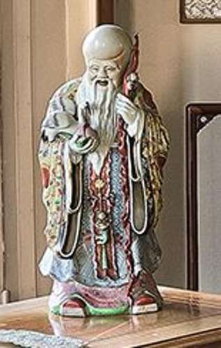 Statuette de Shou Lao debout en porcelaine émaillée polychro...