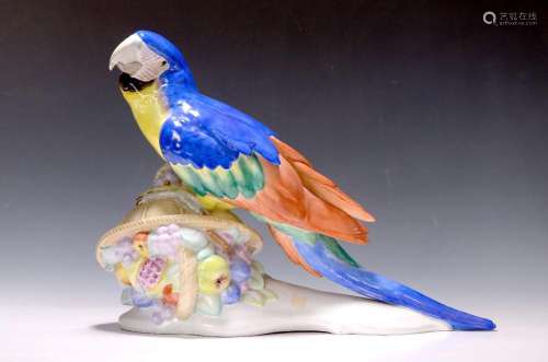 Large porcelain figurine of a yellow-breasted macaw