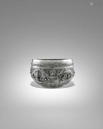 A SILVER OFFERING BOWL WITH BURMESE MONARCHS AND PEACOCK EMB...