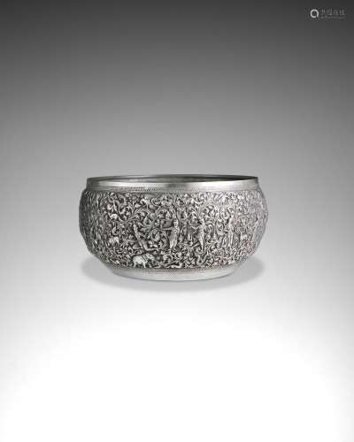 A SILVER OFFERING BOWL WITH FLORAL AND FAUNAL DECORATION BUR...