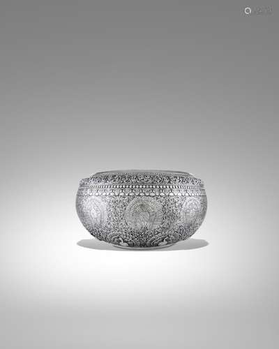 A LARGE SILVER OFFERING BOWL WITH THE PEACOCK EMBLEM OF THE ...