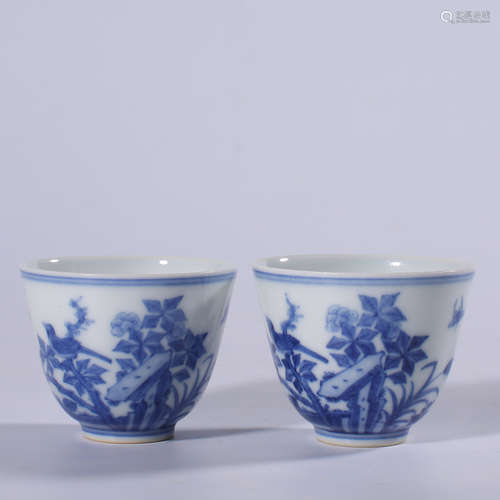 A pair of blue and white cups