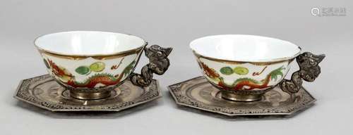 Two tea cups with saucers, probab