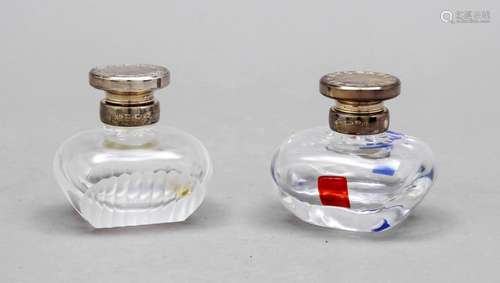 Two perfume bottles with silve