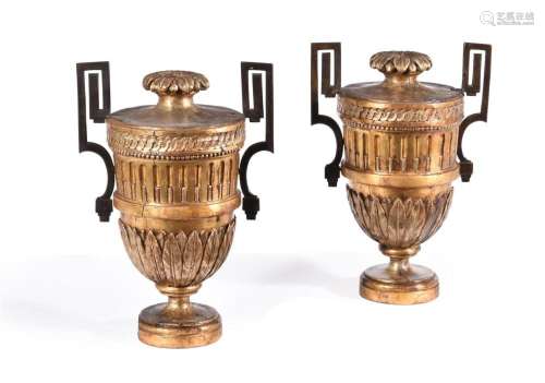 A PAIR OF ITALIAN SILVERED AND GILTWOOD ORNAMENTAL URNS, 18T...