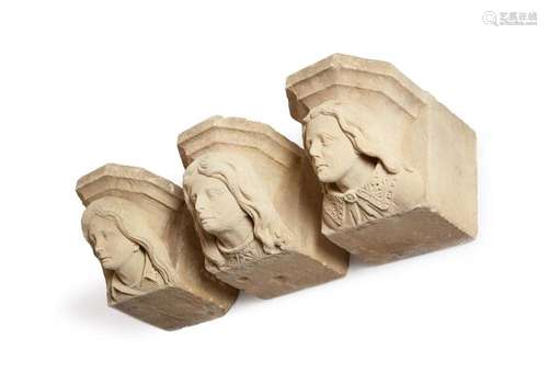 A SET OF THREE CARVED SANDSTONE CORBEL HEADS, PROBABLY LATE ...