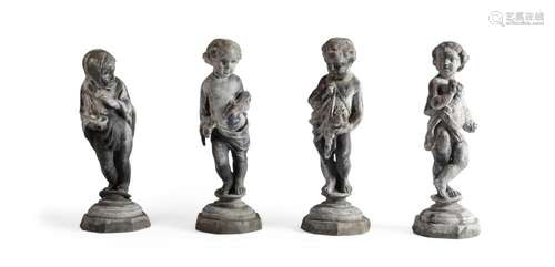 A SET OF FOUR LEAD FIGURES OF CHILDREN EMBLEMATIC OF THE SEA...