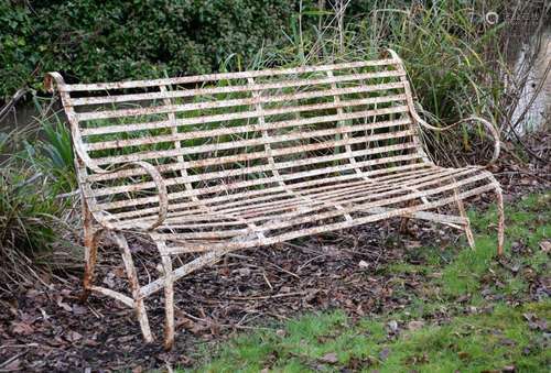 A REGENCY IRON STRAPWORK GARDEN BENCH, EARLY 19TH CENTURY