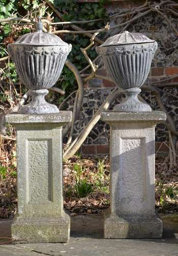 A PAIR OF LEAD URNS AND COVERS, IN THE GEORGE III ADAM STYLE...