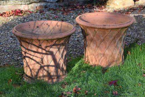 A PAIR OF TERRACOTTA 'BASKETWEAVE' POTS, IN THE MANN...