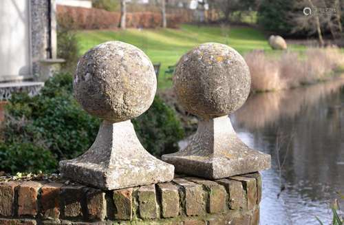 A PAIR OF COMPOSITION STONE BALL PIER FINIALS, 20TH CENTURY