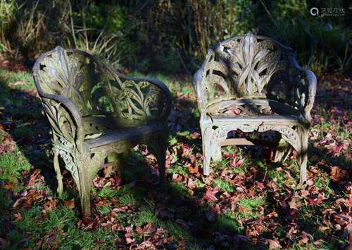 A PAIR OF VICTORIAN CAST IRON GARDEN SEATS IN THE MANNER OF ...