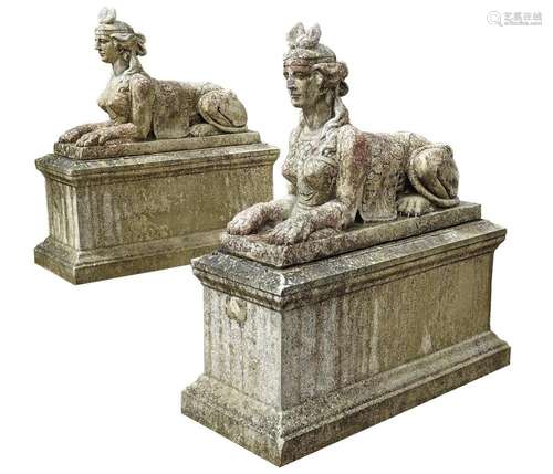 A PAIR OF CAST STONE SPHINXES ON PEDESTAL BASES, 20TH CENTUR...