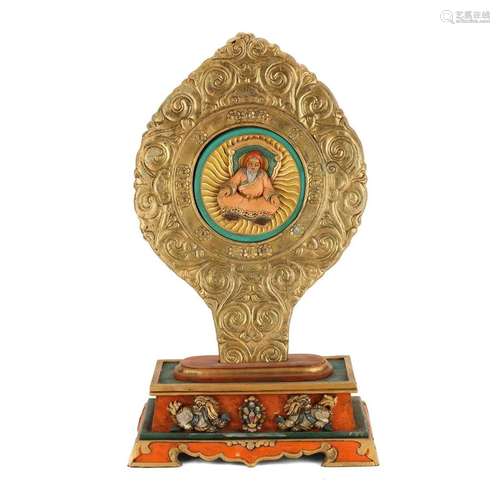 A BUDDHA PLAQUE ON STAND, TIBET