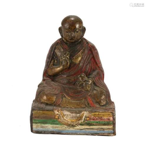 A CLAY FIGURE OF A LAMA, TIBET