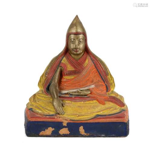 A CLAY FIGURE OF A LAMA, TIBET