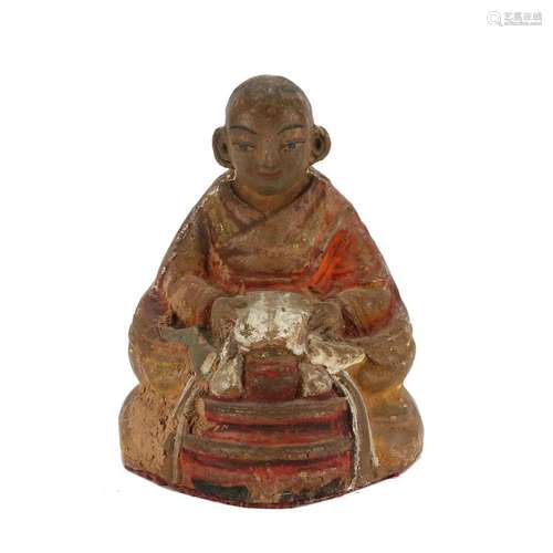 A CLAY FIGURE OF A LAMA, TIBET