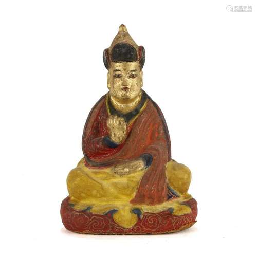 A CLAY FIGURE OF A LAMA, TIBET