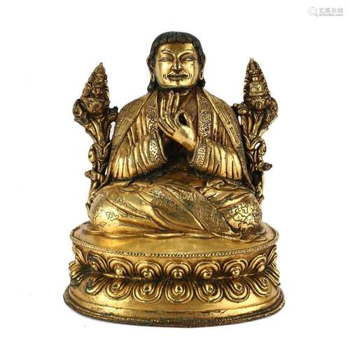 A GILT-BRONZE FIGURE OF A LAMA, TIBET