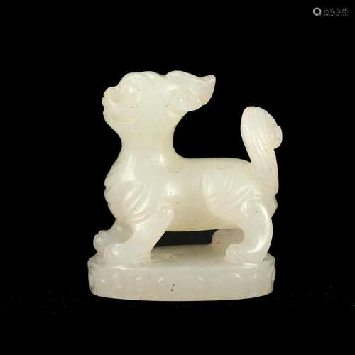 A WHITE JADE BEAST CARVING