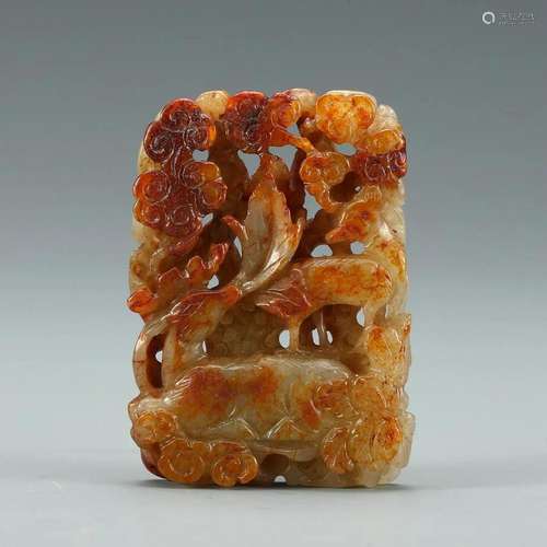 A WHITE AND RUSSET JADE PENDANT