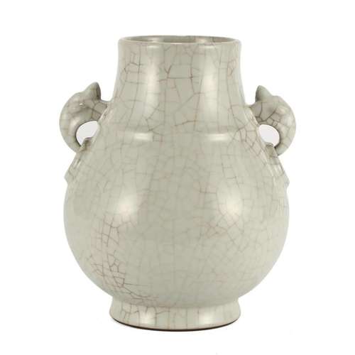 A 'GE' WHITE-GLAZED JAR WITH HANDLES