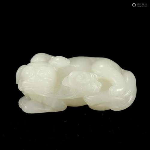 A WHITE JADE BEAST CARVING