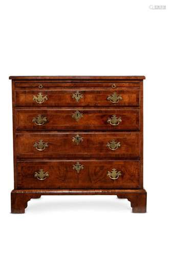 A GEORGE II WALNUT AND FEATHERBANDED CHEST OF DRAWERS, SECON...