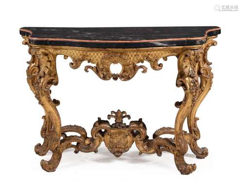 A CONTINENTAL CARVED GILTWOOD SERPENTINE CONSOLE TABLE PROBA...