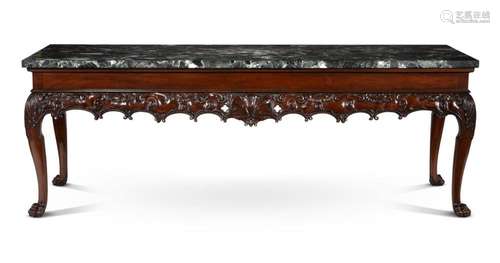 A CARVED MAHOGANY AND MARBLE TOPPED CONSOLE TABLE, IN GEORGE...