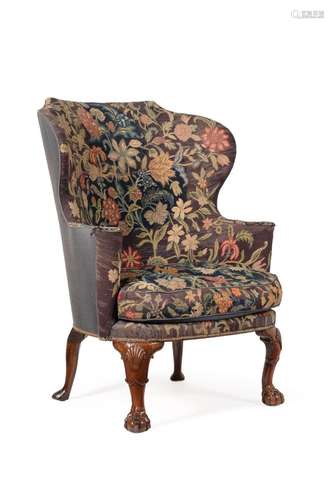 A GEORGE II WALNUT WING ARMCHAIR, CIRCA 1735