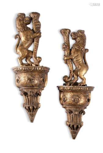 A PAIR OF GILTWOOD WALL MOUNTS IN THE FORM OF HERALDIC LIONS...