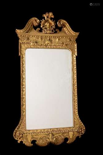 A GEORGE II GILTWOOD AND GESSO WALL MIRROR, IN THE MANNER OF...