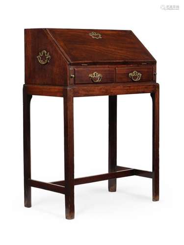 A GEORGE II MAHOGANY BUREAU ON STAND, IN THE MANNER OF THOMA...