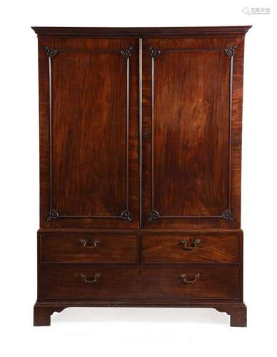 AN EARLY GEORGE III MAHOGANY CLOTHES PRESS, ATTRIBUTED TO IN...