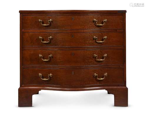 AN EARLY GEORGE III MAHOGANY SERPENTINE COMMODE, IN THE MANN...