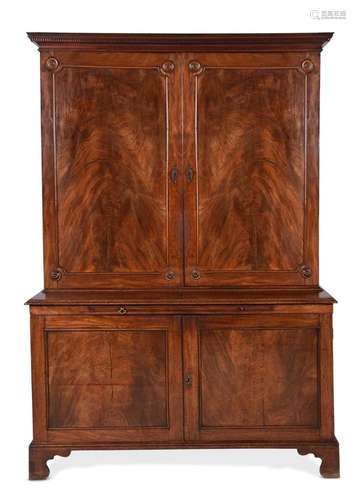 A GEORGE III MAHOGANY BOOKCASE CABINET, IN THE MANNER OF THO...