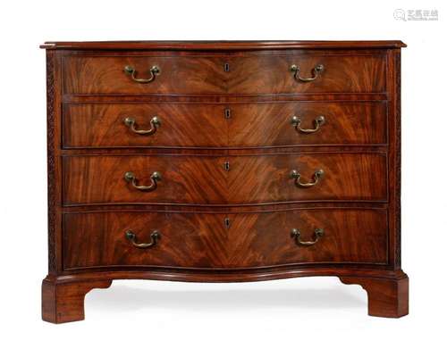 A GEORGE III FIGURED MAHOGANY SERPENTINE DRESSING COMMODE, I...